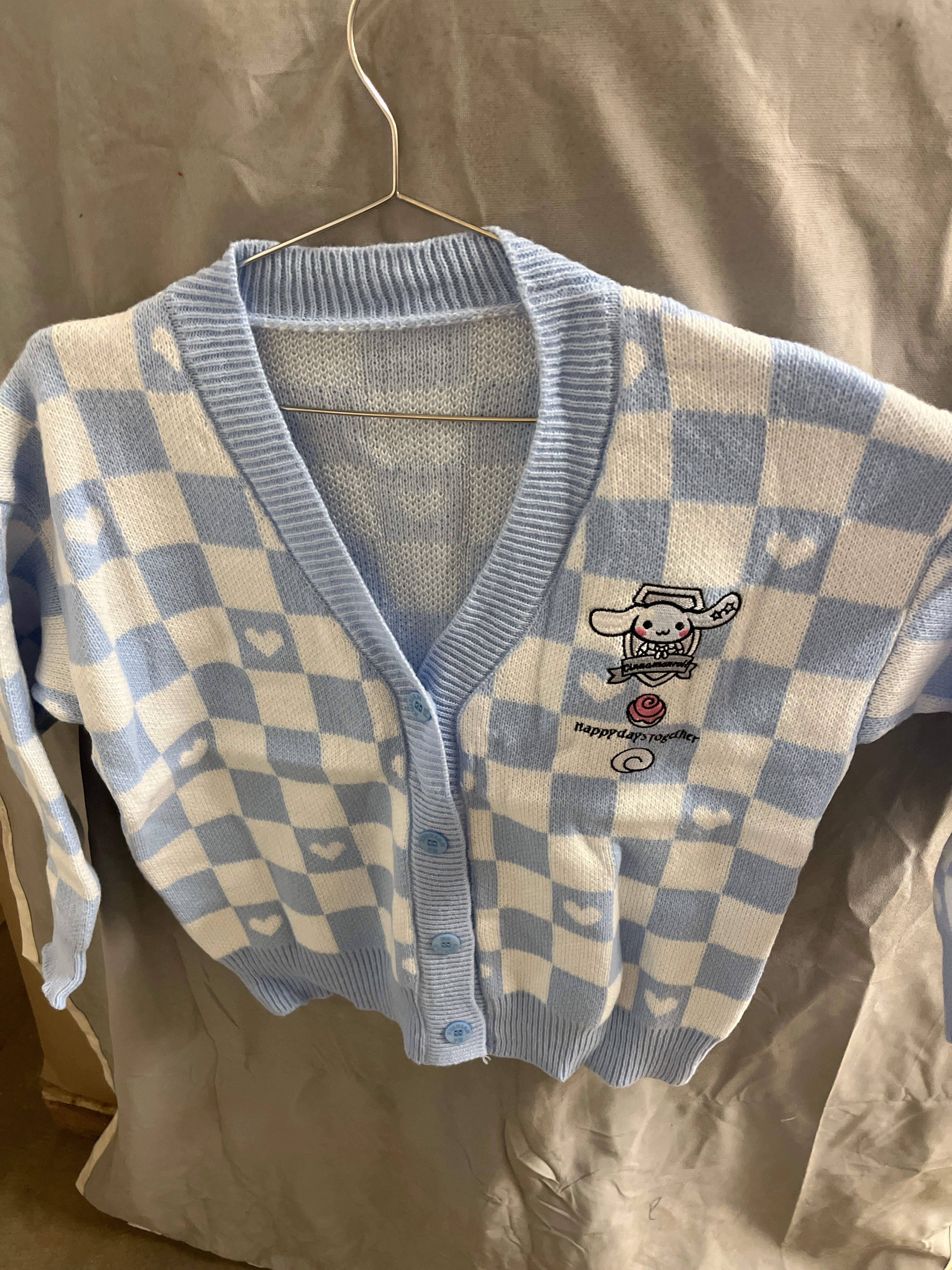 Blue and white checkered sweater