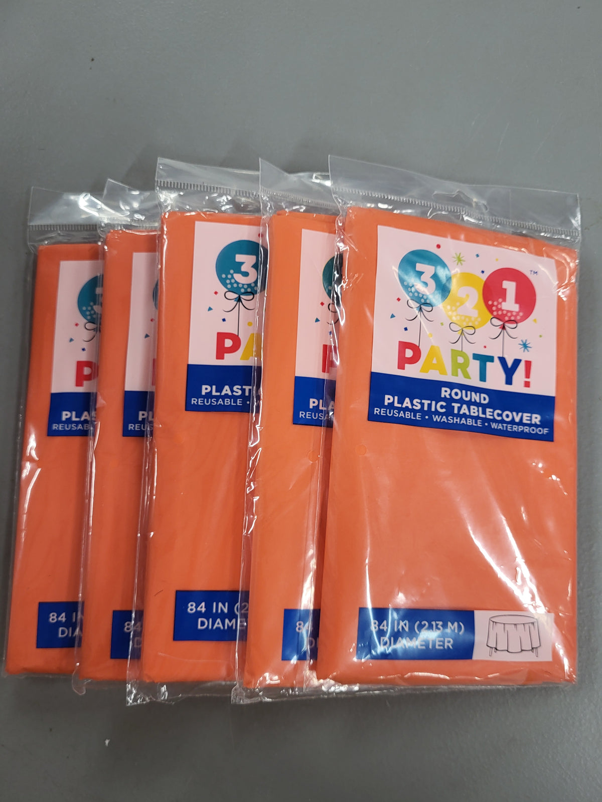 Orange Round Plastic Tablecloth, 84in (5 pack)