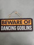 Beware of Dancing Goblins Hanging Sign